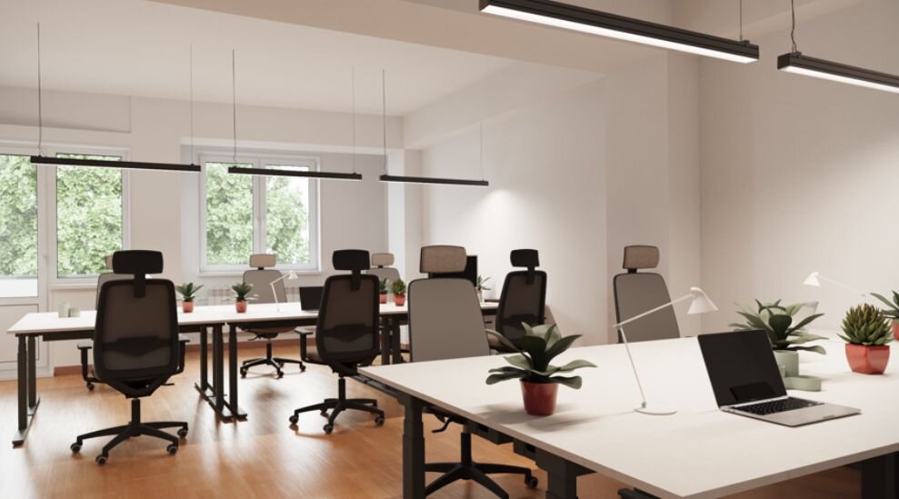 Rendering of an open-plan office fitted out with desks and pendant lights